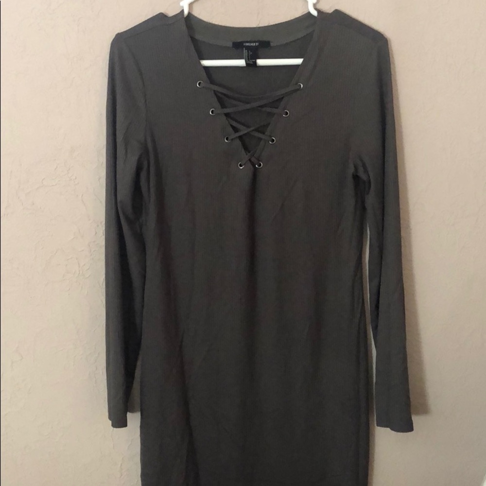 Tight, dark green dress